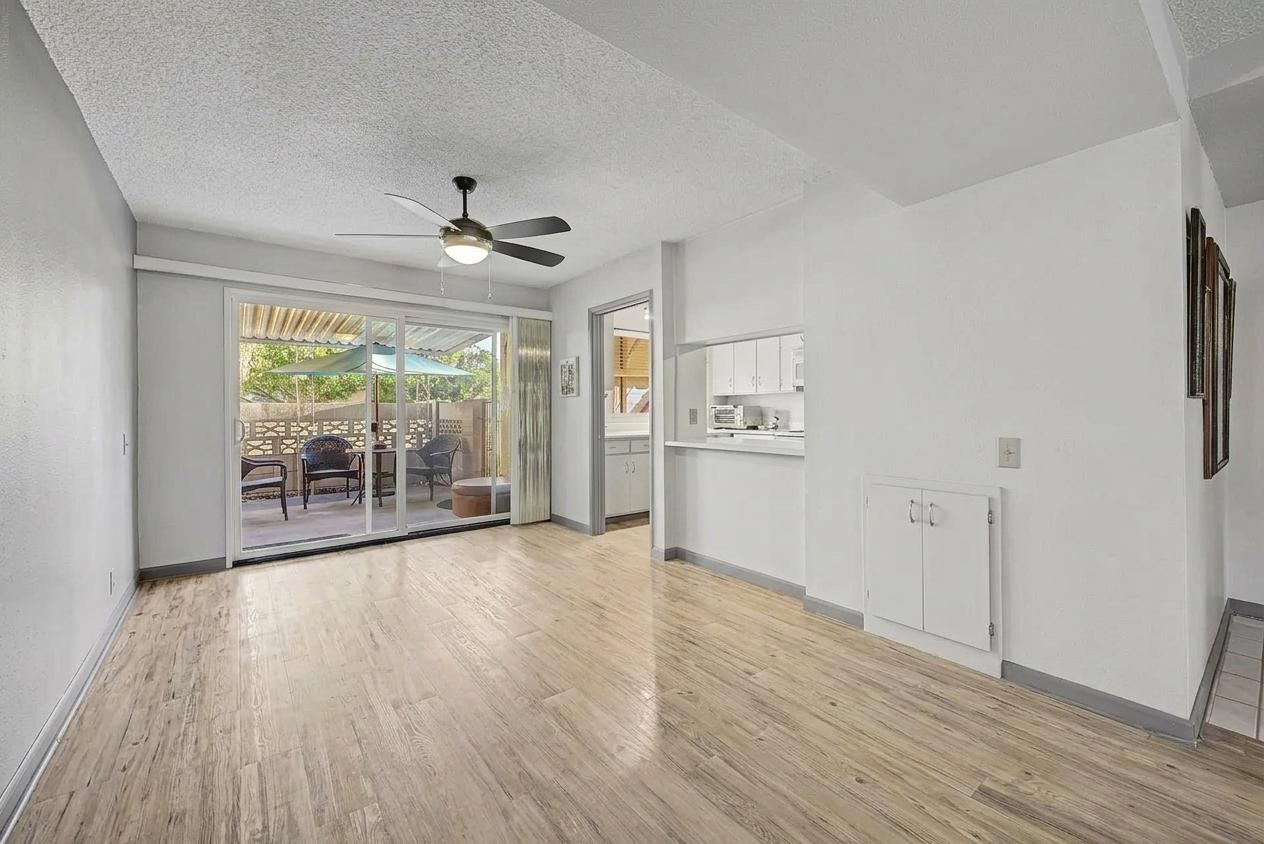 Dining area and kitchen pass-through, unfurnished