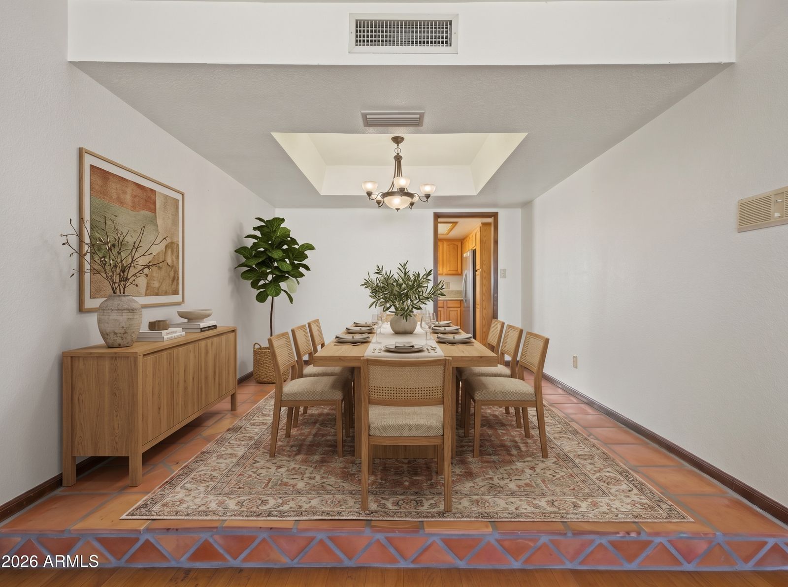 Formal dining room, virtually staged with a table and chairs