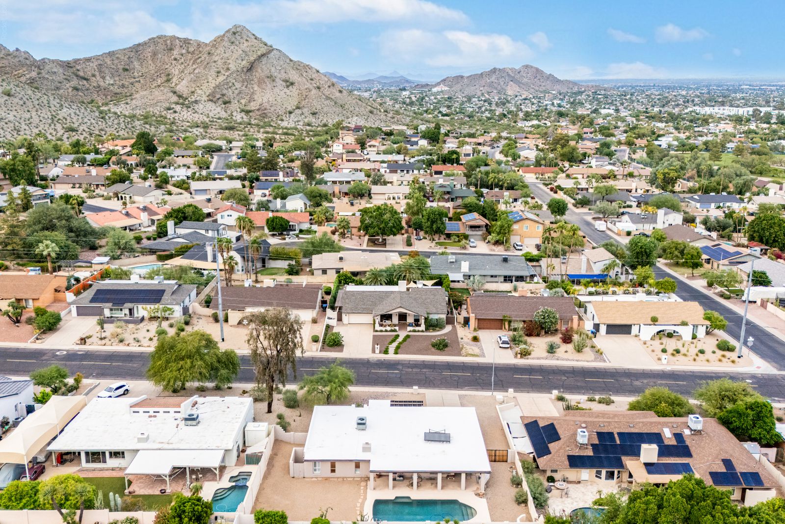 Aerial view of the home with the mountain behind
