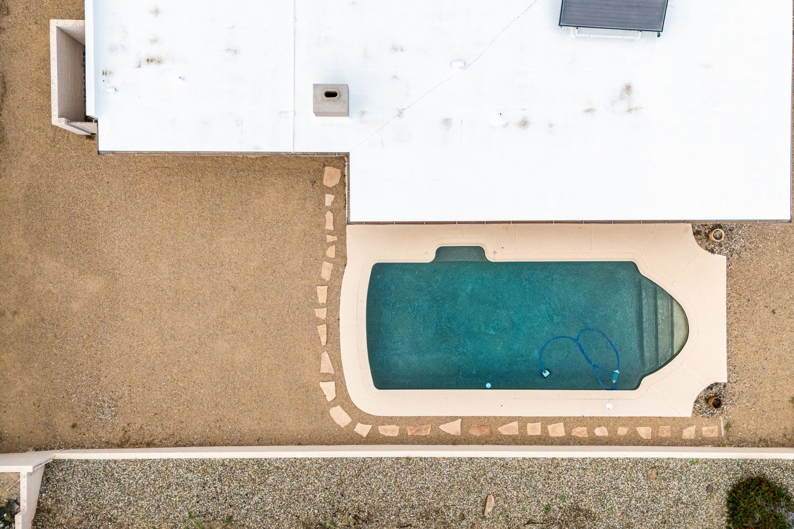 Overhead view of the pool and backyard