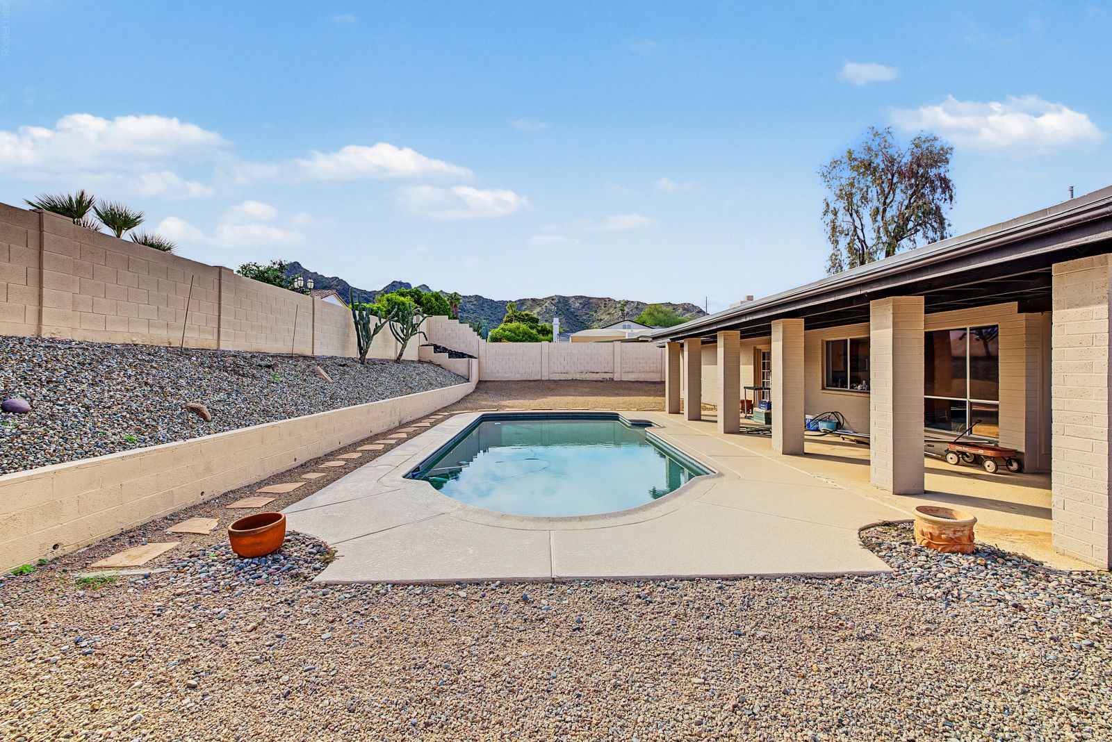 Pool, covered patio and mountain view