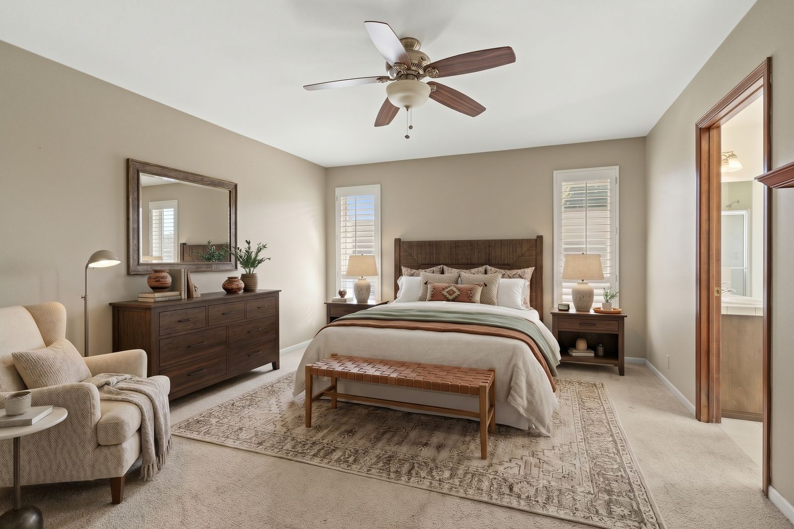 Primary bedroom, virtually staged with furniture and decor